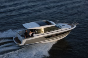 motor cruiser underway at speed, featuring panoramic wheelhouse windows, opening sunroof and spacious aft cockpit